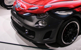Illustration for article titled Electric Fiat 500 Elettra Pokes Nose Out From Vintage Camo Cover